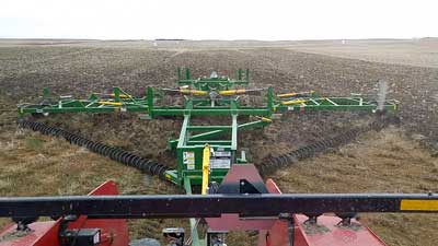 Close-up view of a Kelly Chain cultivating the alfalfa field