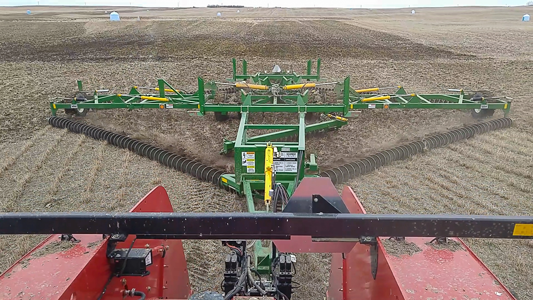 Close-up view of a Kelly Chain cultivating the alfalfa field